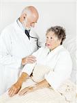 Senior hospital patient gets a thorough medical exam from her doctor.