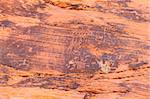 Strange petroglyphs on a rock wall at Valley of Fire State Park in Nevada.