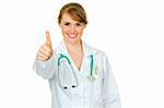 Smiling medical female doctor showing thumbs up gesture isolated on white