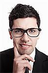 Funny portrait of a young businessman with a nerd glasses