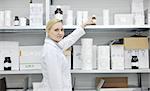 woman worker in pharmacy company warehouse