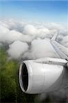 airplane wing aircraft turbine flying jungle bottom white clouds