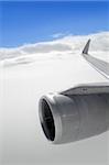 airplane wing aircraft turbine flying blue sky white clouds