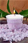 purple candle and sea salt spa concept