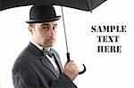 Portrait of a man with bowler hat and an umbrella  over white