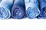 Rolls of Blue Jeans isolated on white background with copy space for your text