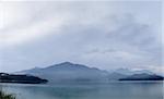 Panoramic landscape of lake with mountain under cloudy sky, famous attraction, Sun Moon Lake situated in Yuchi, Nantou, Taiwan, Asia.