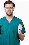 A young surgeon with a scalpel on a white background