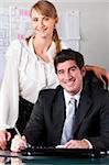 businesswoman at office with her boss in chair
