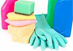 Variety of cleaning products such as sponges, gloves, and bottles with chemicals isolated on white background