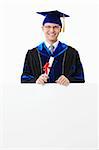 Young student with a diploma with an empty billboard on a white background