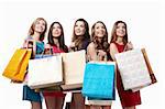 Attractive girl with shopping looking up on white background