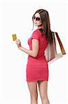 Girl with shopping bags and credit cards in sunglasses on white background