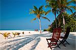 beach chairs on a perfect tropical island