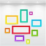 Gallery Interior with empty colorful frames on wall