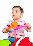 little kid playing with colorful toys on a white background