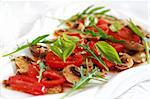 Champignon Carpaccio with marinated tomato and rucola salad