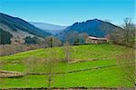 Field on the Slopes of The Pyrenees With Old Farmhouse