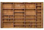 vintage wood  printer  (typesetter) drawer with numerous dividers, isolated on white