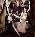 Two gorgeous Arab belly dancers with Indian man playing Sitar