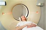 A young woman undergoing a CT scan in a hospital