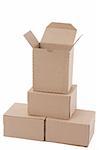 Brown cardboard boxes arranged in stack on white background