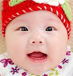 5 months old Asian baby girl smiling