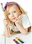 cute little girl with paints in studio