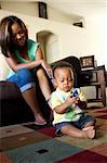 African american mother playing with her son