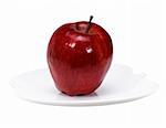 red apple on a apple shaped dish over white