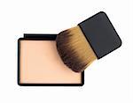 Beige compact cosmetic powder and brush isolated on white