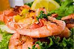 photo of delicious grilled prawns over lettuce bed with peperoni