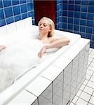 A woman soaking in a relaxing bath in an old style spa