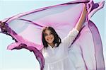 beautiful young woman on beach with scarf relax smile and have fun