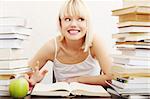 Young student woman with lots of books studying for exams. isolated on white background