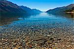 View of the clear waters and mountains at lake Wakatipu, New Zealand