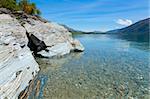 View of the clear waters and mountains at lake Wakatipu, New Zealand