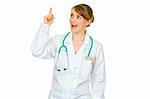 Surprised medical doctor woman with rised finger isolated on white. Idea gesture