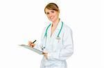 Smiling  doctor woman making notes in medical chart isolated on white