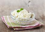 fresh cottage cheese on old wooden table