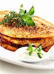 Delicious potato pancakes with curd cheese and herbs