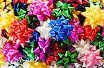 Large heap of colorful decorative bows