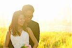 Outdoor Bride and Groom, surrounding by natural morning golden sunlight.