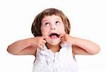 A portrait of a young adorable girl making faces over white background