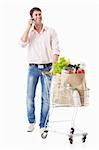 Man talking on the phone keeps a cart with food on a white background