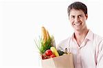 Attractive man with food on a white background