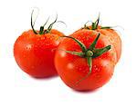 Three fresh wet tomatoes isolated on white background