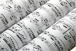 Three music sheets on a row isolated in white