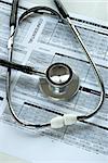 A stethoscope and the medical audit document