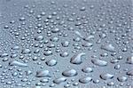 Water droplets on a shining mettallic surface